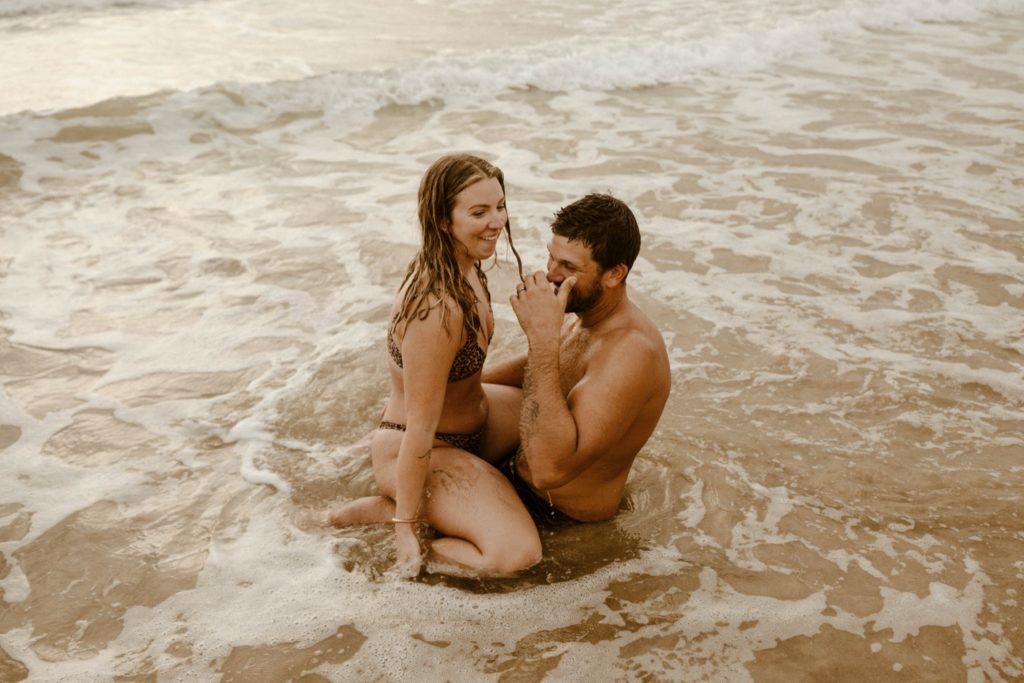 couple being playful in the water