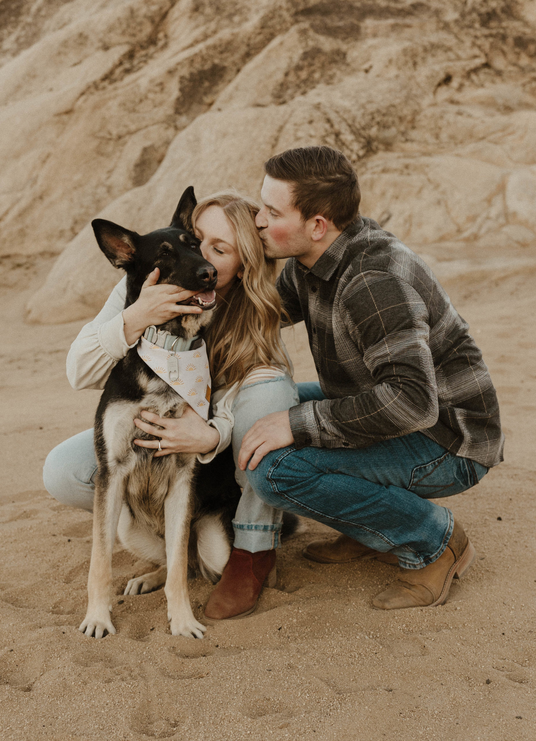 couple in the desert with their dog