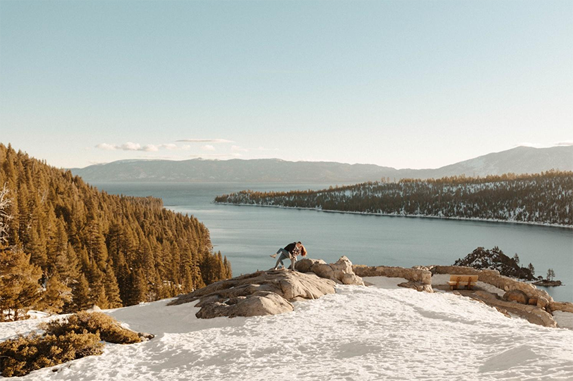couple kissing at Emerald Bay overlooking Lake Tahoe