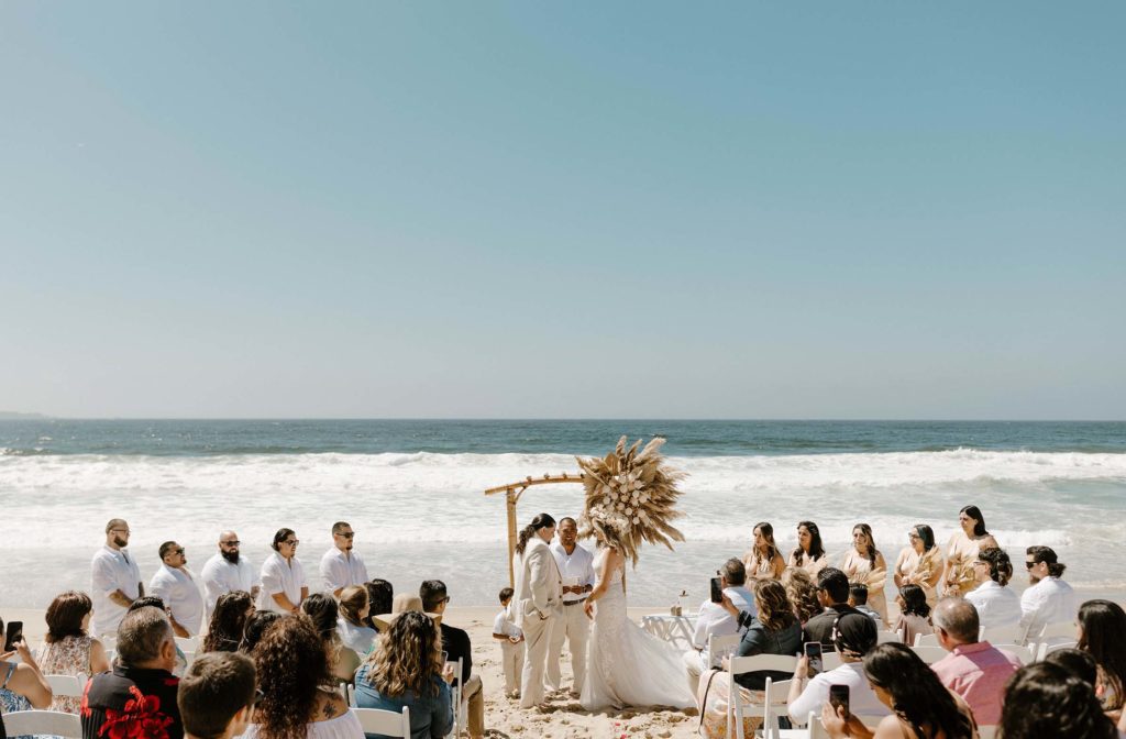 bride and groom wedding ceremony on the beach in monterey