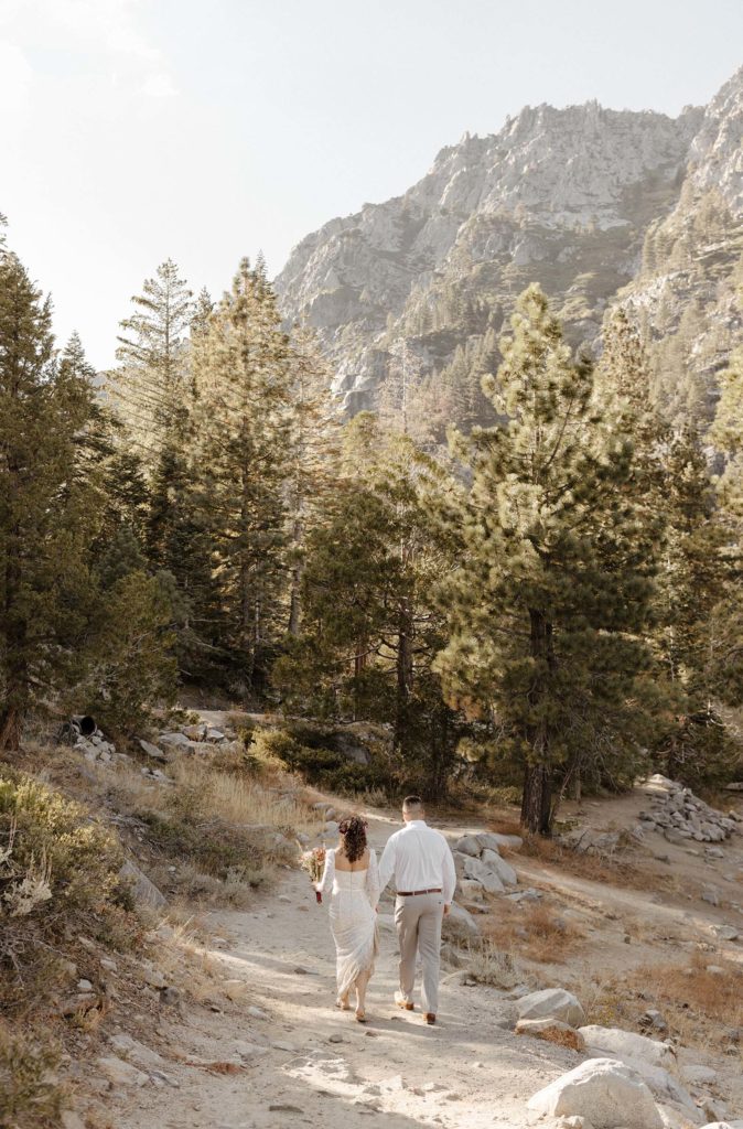 elopement couple walking together at emerald bay