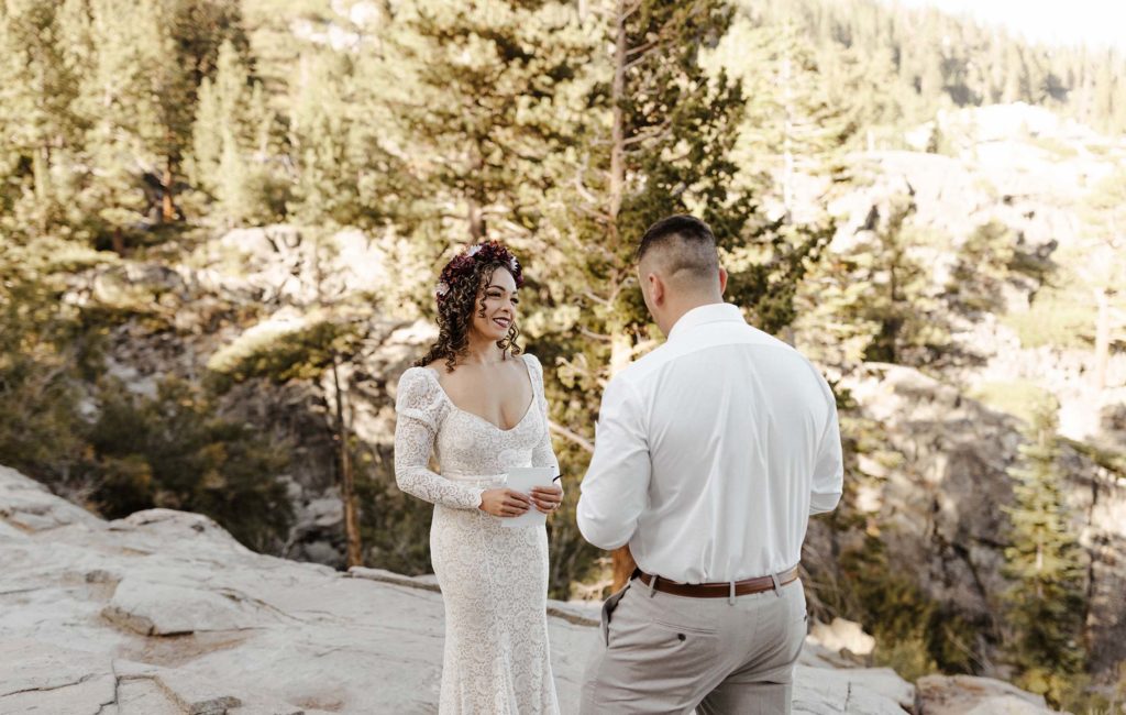 bride and groom reading vows in lake tahoe