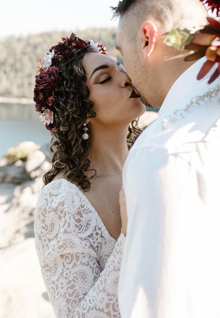 bride and groom kissing at emerald bay