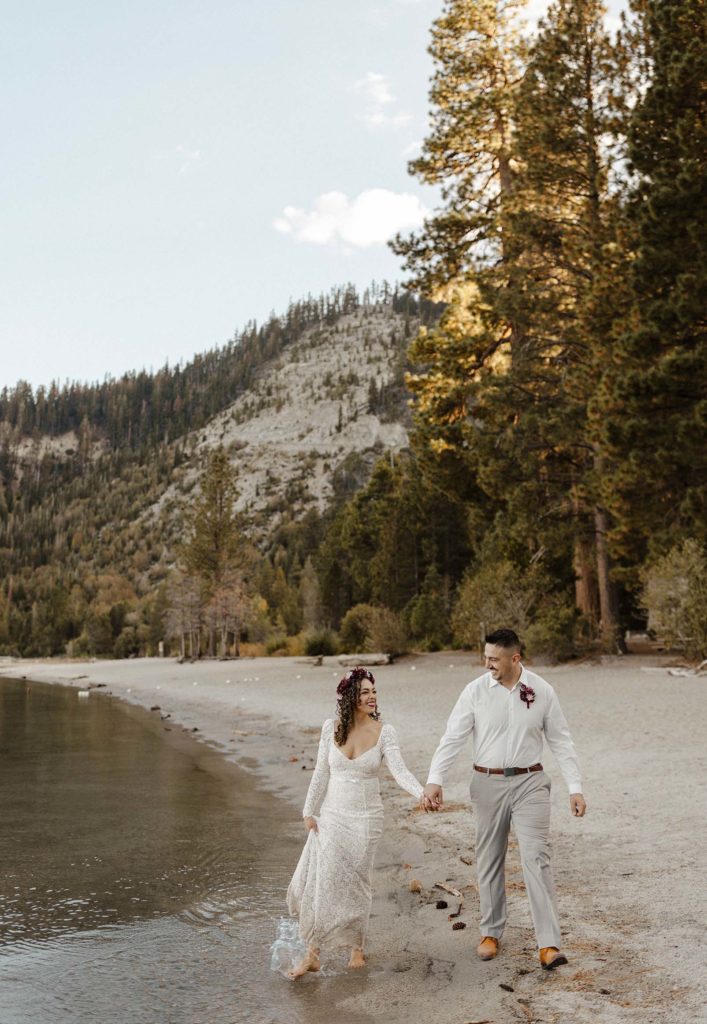 elopement couple running on the beach at emerald bay