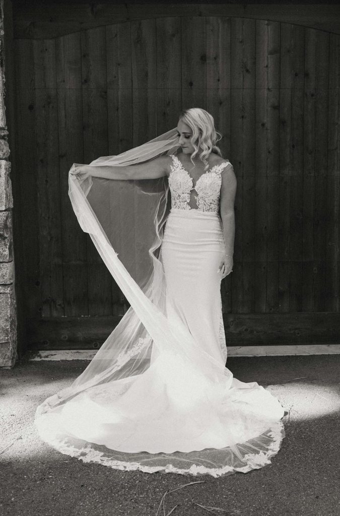 the bride playing with her veil at the resort at squaw creek