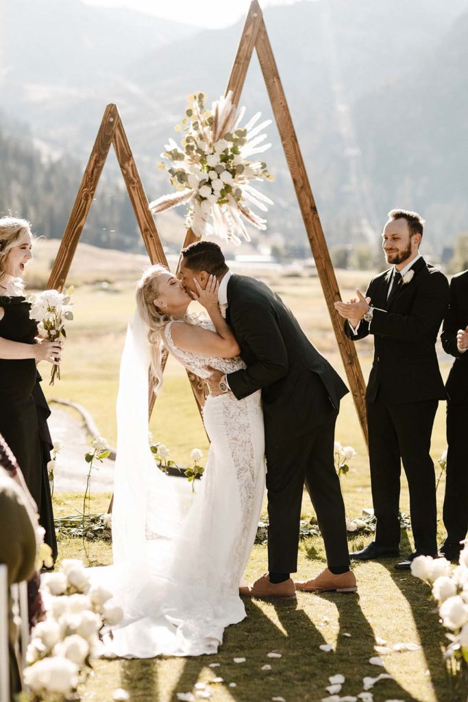 bride and grooms first kiss at the resort at squaw creek