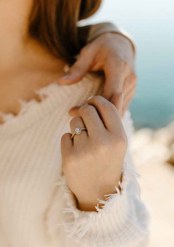 Close up of engagement ring on hand at Lake Tahoe