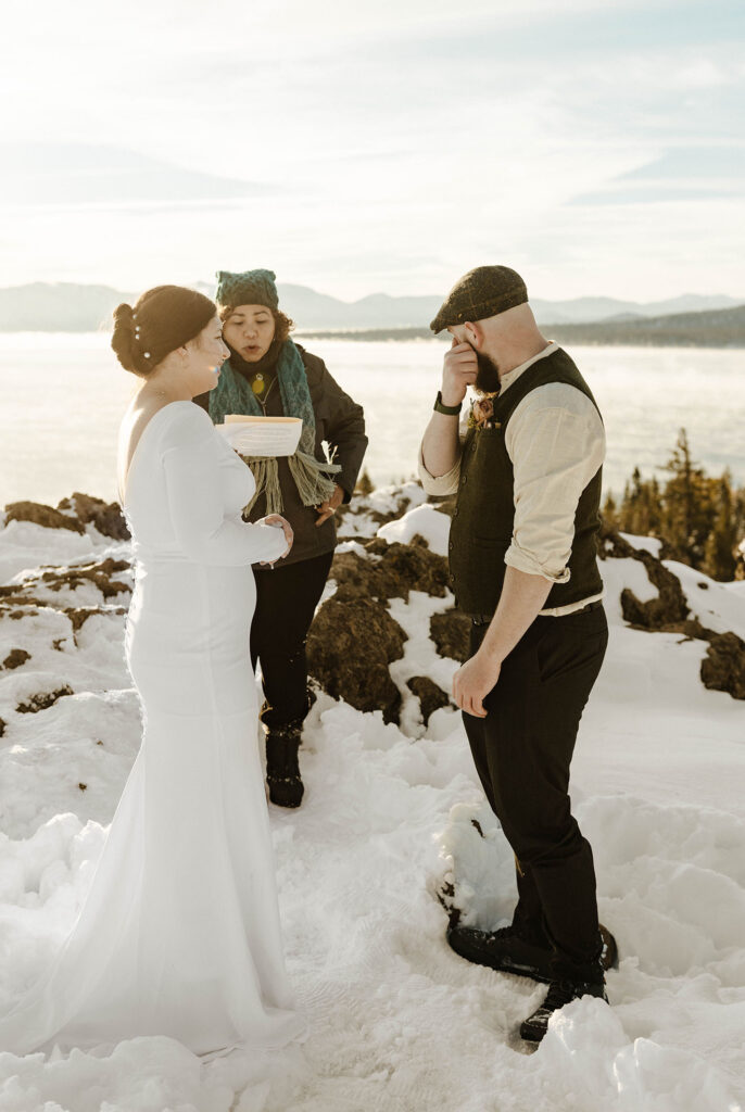 groom wiping his tears during their ceremony in lake tahoe