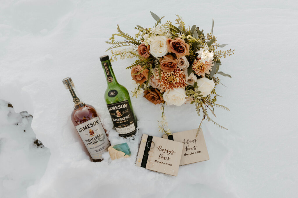 winter elopement details laid out in the snow