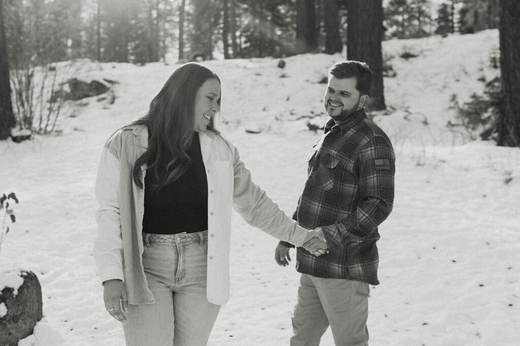 couple walking in the snow in lake tahoe