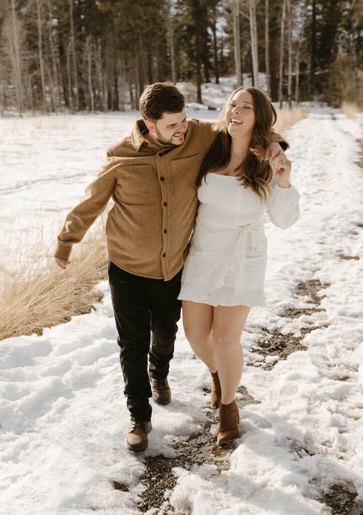 couple laughing in the snow 