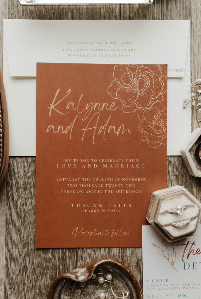 wedding invites laid out at tuscan falls