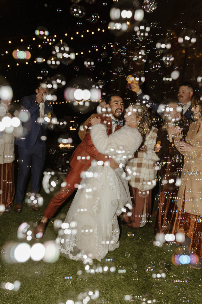 bride and groom dancing with bubbles at tuscan falls wedding