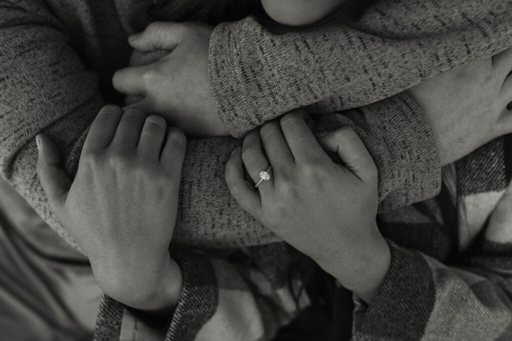 couples arms wrapped around each other showing off wedding ring