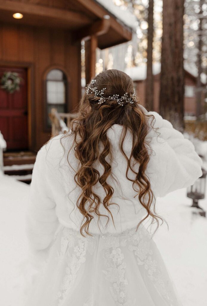 brides curly hair with jewels in it 