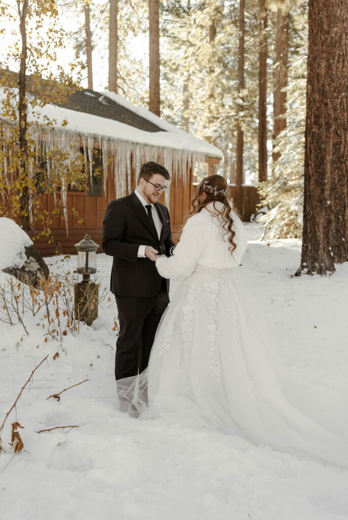 groom smiling during his first look with his bride in lake tahoe