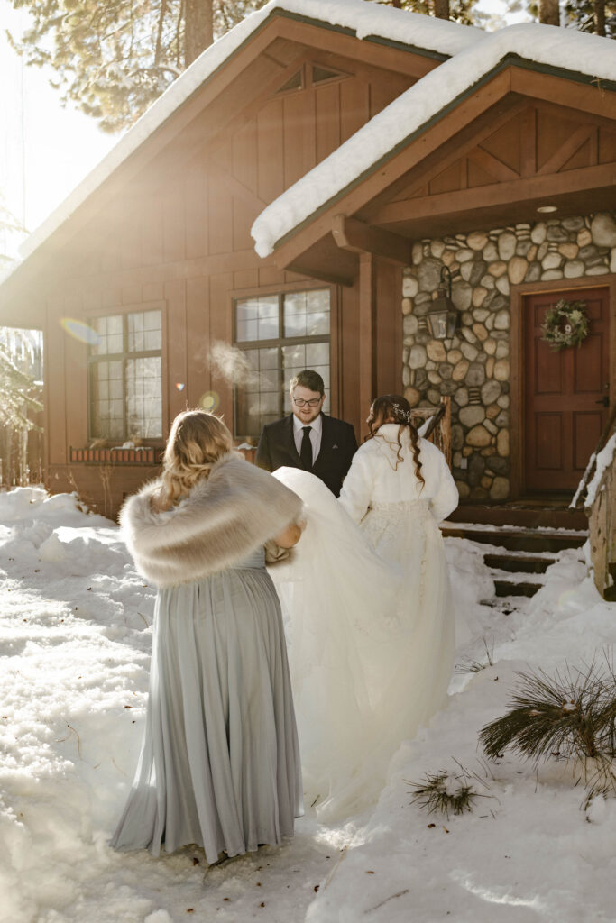 elopement couple walking through the snow in lake tahoe