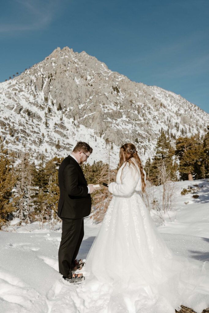 elopement couple sharing vows in the snow in lake tahoe