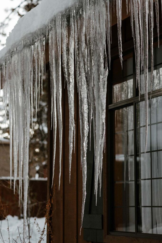 icicles hanging from a cabin in lake tahoe