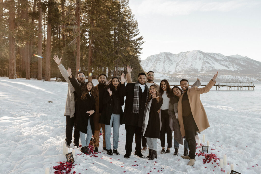 a couple celebrating after a proposal with their friends in south lake tahoe