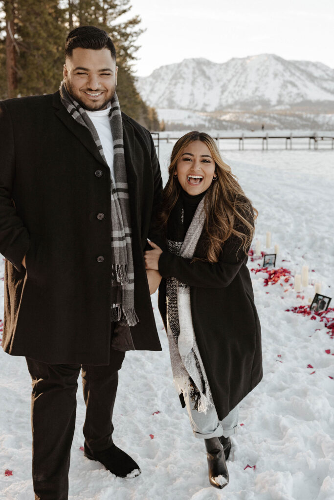 couple walking and smiling in south lake tahoe in the winter