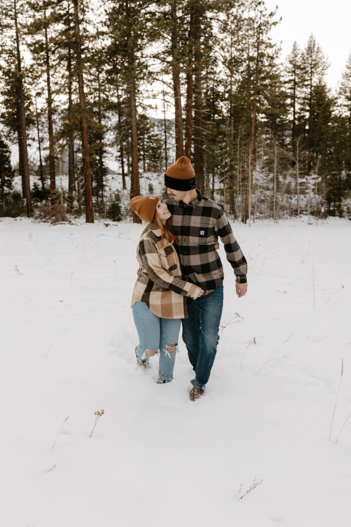 couple wearing plaid in the snow in lake tahoe