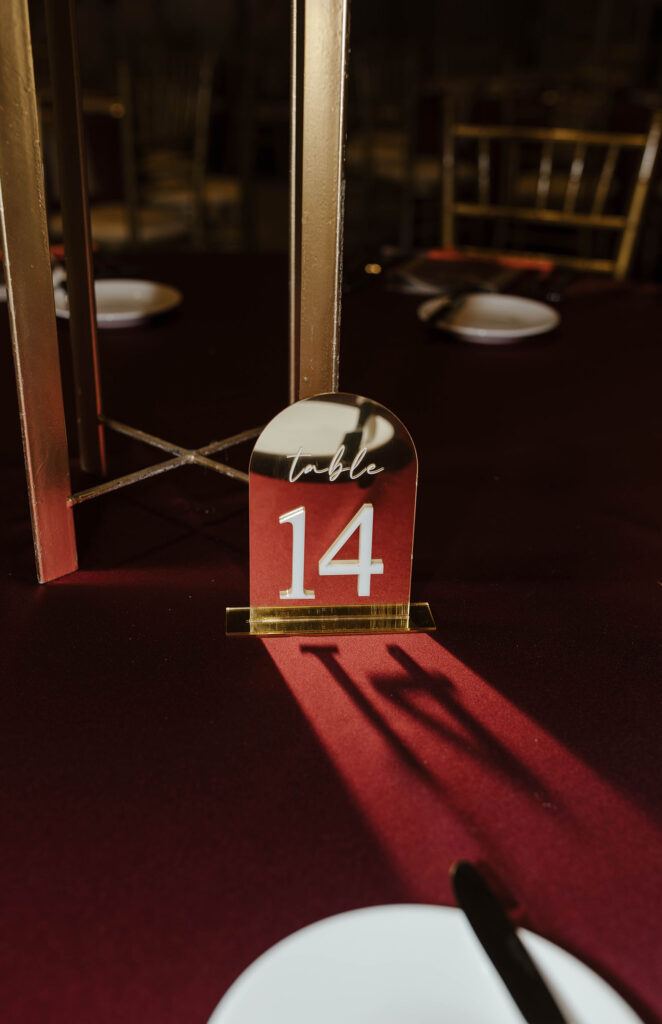 maroon table numbers for a winter wedding at the whitney peak hotel