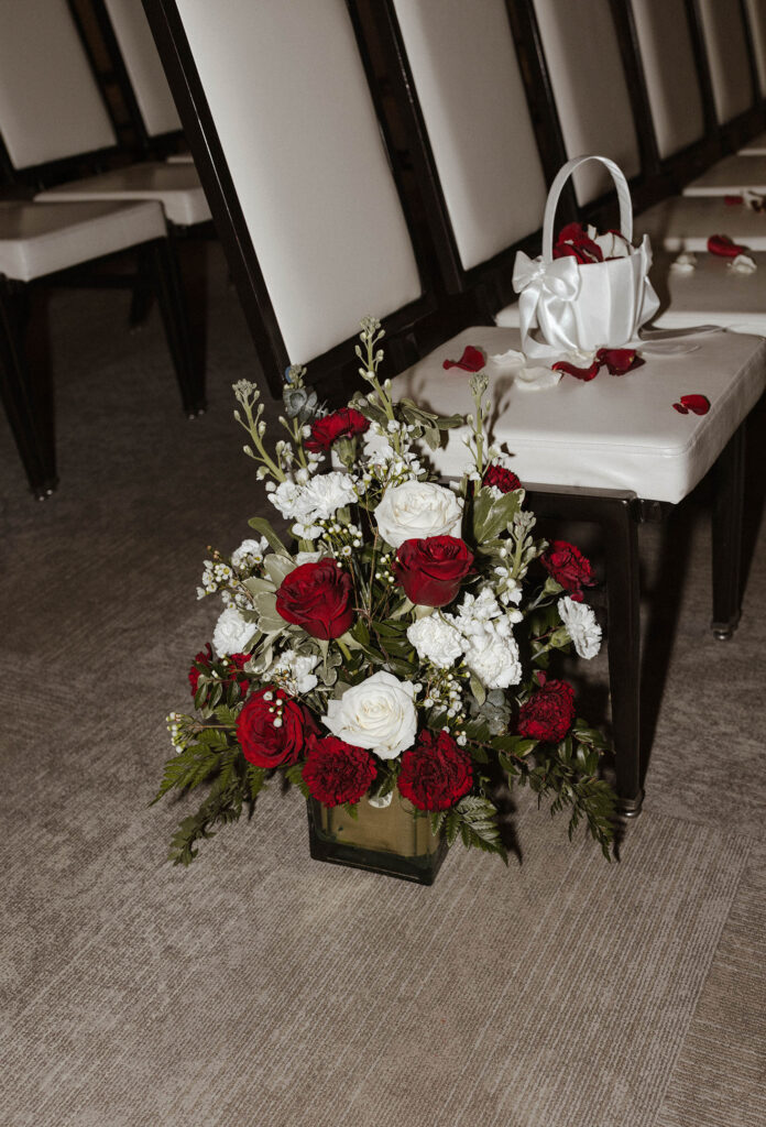 red and white ceremony florals for a winter wedding at the whitney peak hotel