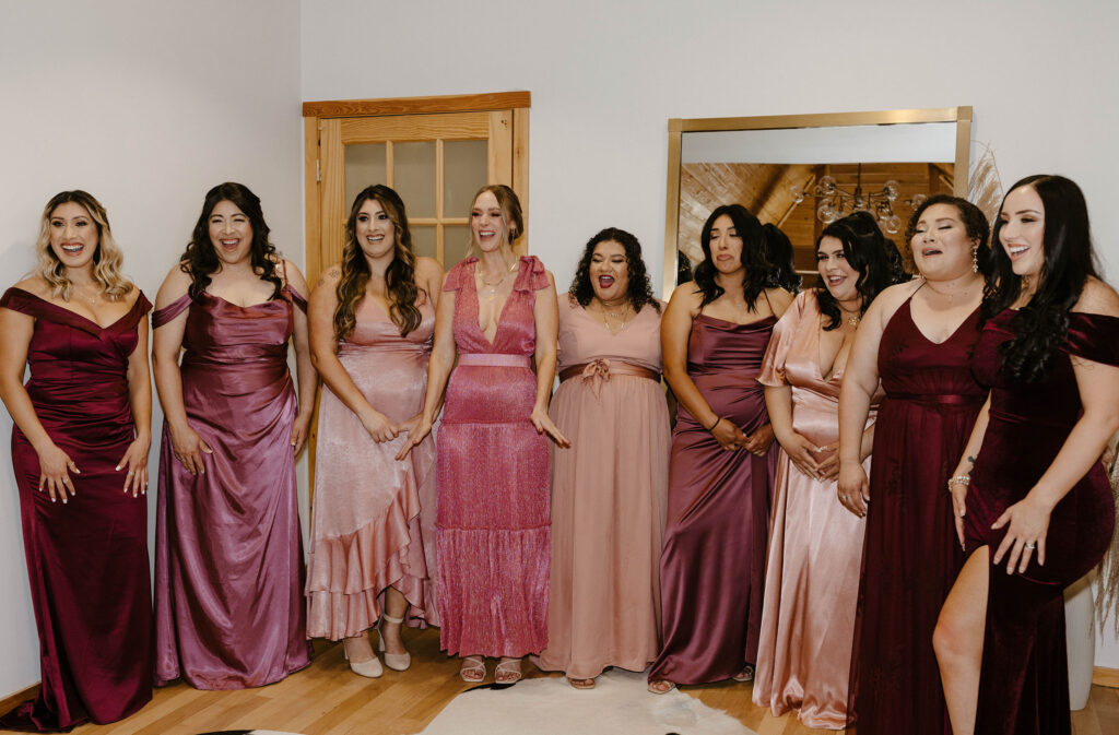 Bridesmaids reacting to bride in wedding dress and emotional inside at the Chalet View Lodge