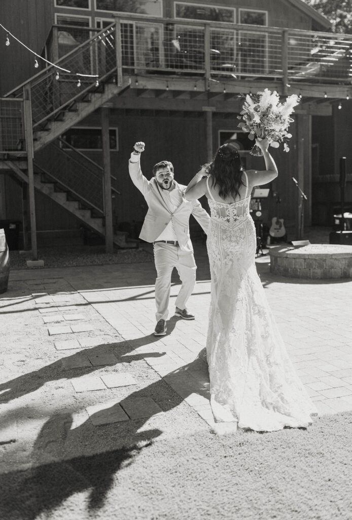 Wedding couple dancing and celebrating during grand entrance in Lake Tahoe
