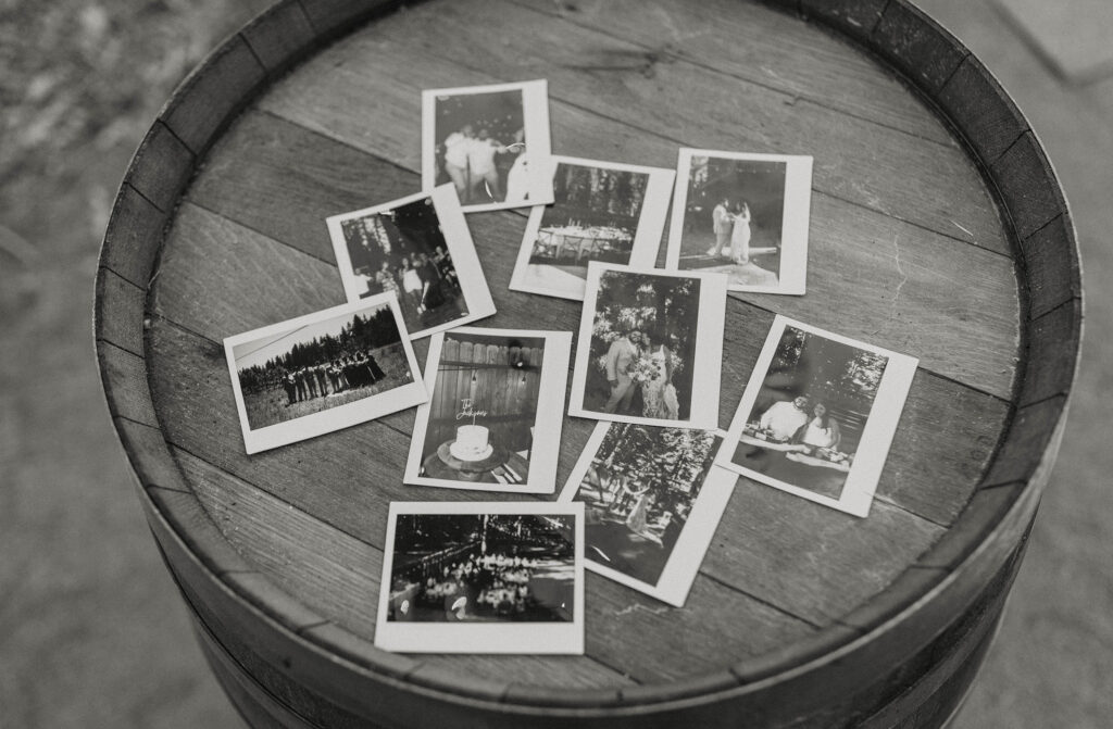 Polaroid print photos on wooden barrel at wedding in Lake Tahoe