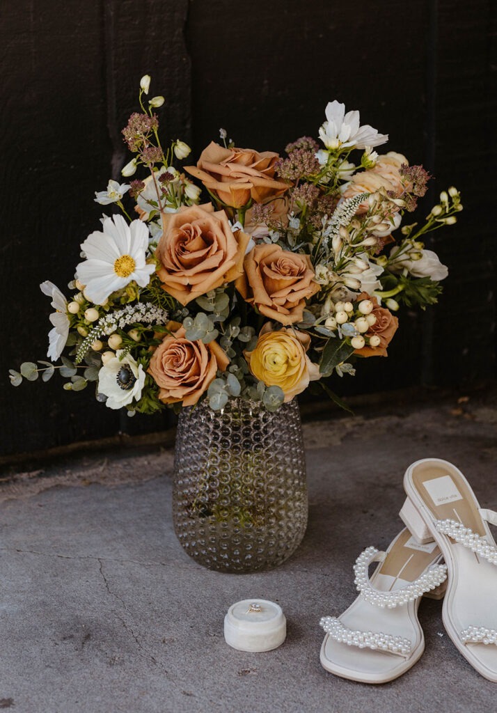 Brown and neutral floral bouquet in a textured vase at the Coachman hotel in Lake Tahoe