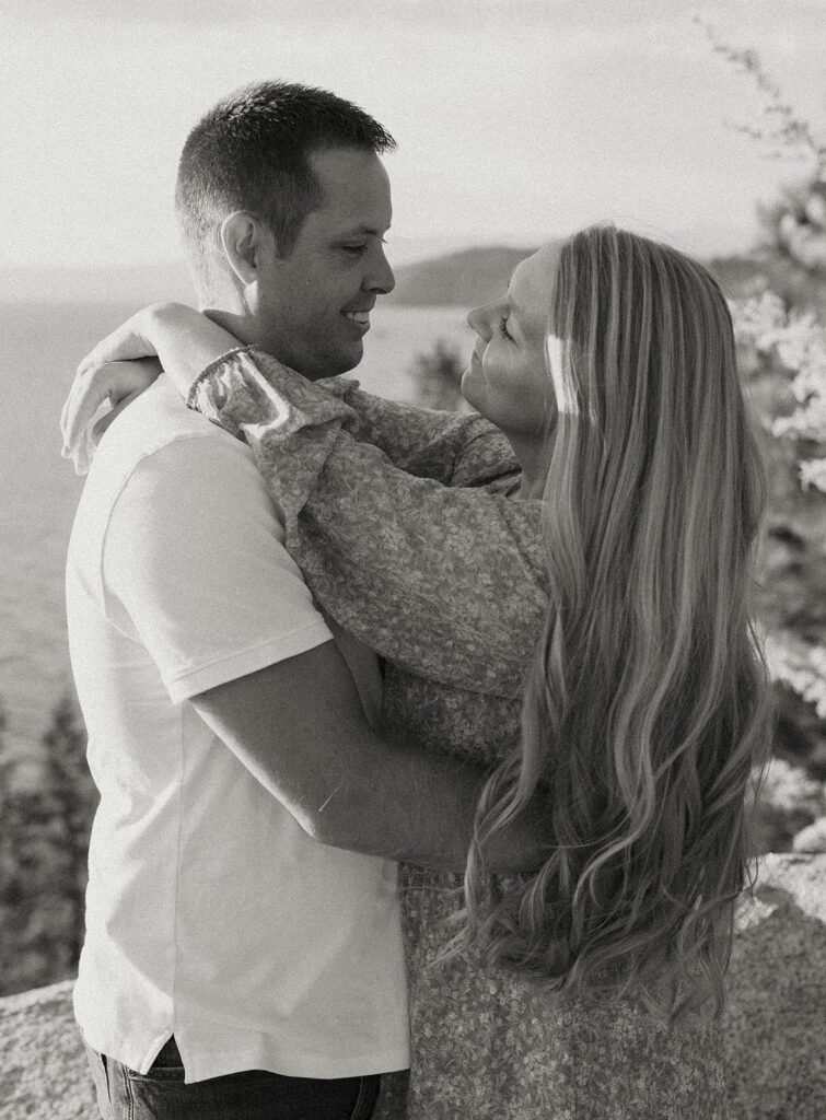 black and white photos of a maternity couple swaying and smiling in lake tahoe during the summer