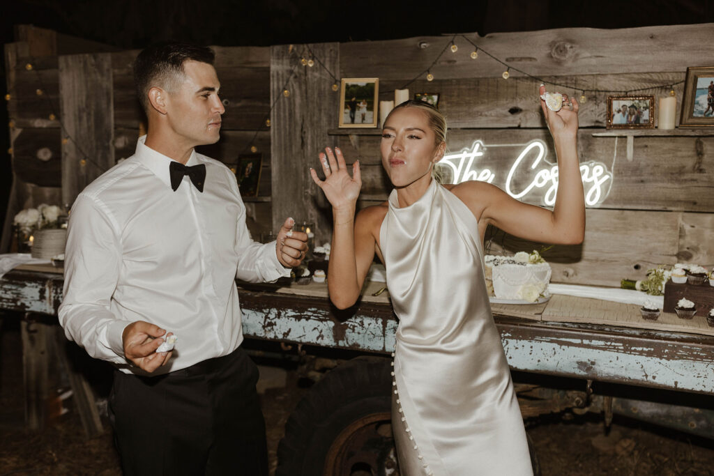 bride and groom eating cake and dancing at their summer wedding at kinship ranch