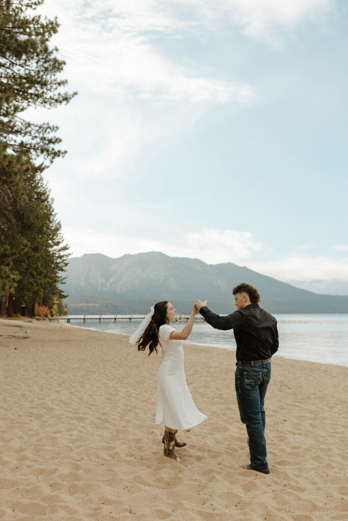engagement couple dancing on the beach in south lake tahoe