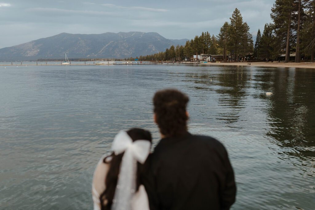 couple blurry looking at south lake tahoe in focus