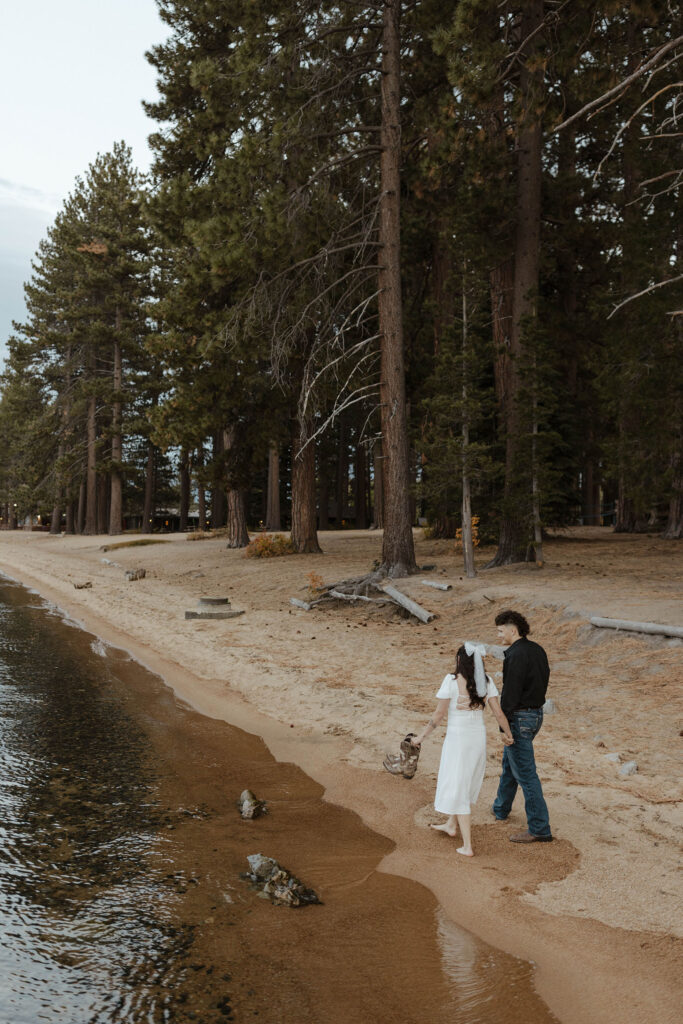engagement couple walking along the beach in south lake tahoe