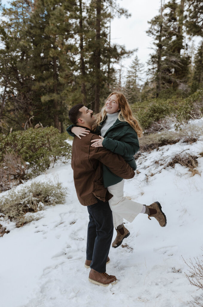 couple dancing in the snow in lake tahoe