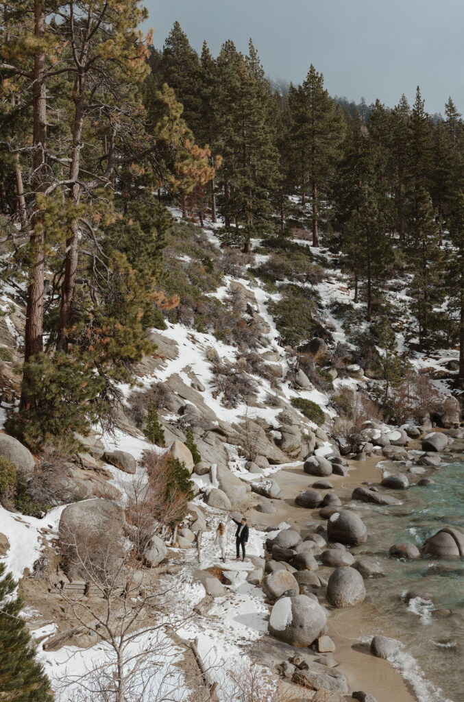 couple dancing in the snow at secret cove in lake tahoe