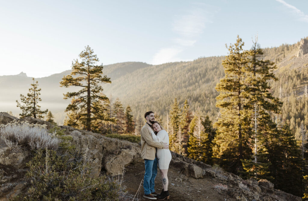 couple hugging at eagle rock in lake tahoe