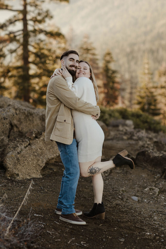 couple hugging and smiling at eagle rock lake tahoe