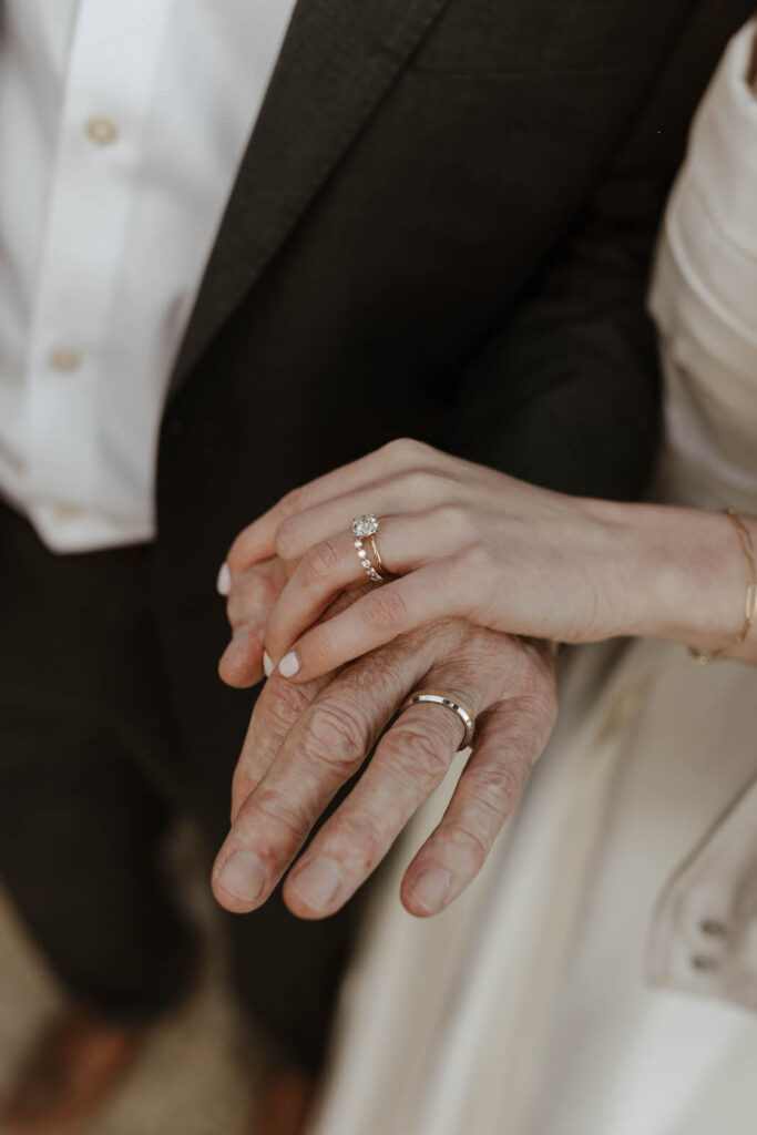 man and woman showing wedding rings 