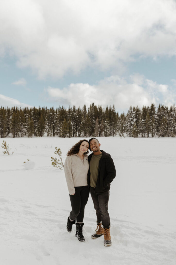 couple smiling in the snow at mount rose meadows