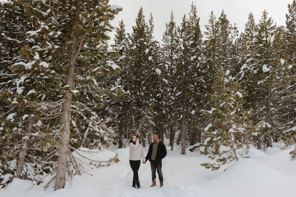 couple standing in the snow at mount rose meadows