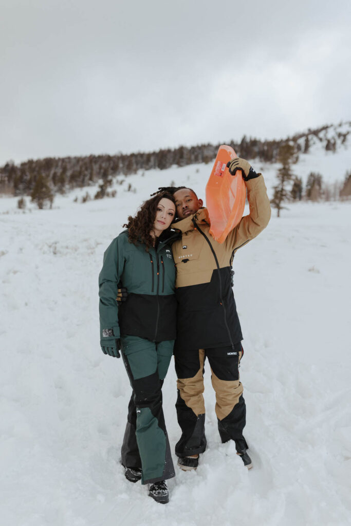 engagement couple in ski gear at mount rose meadows