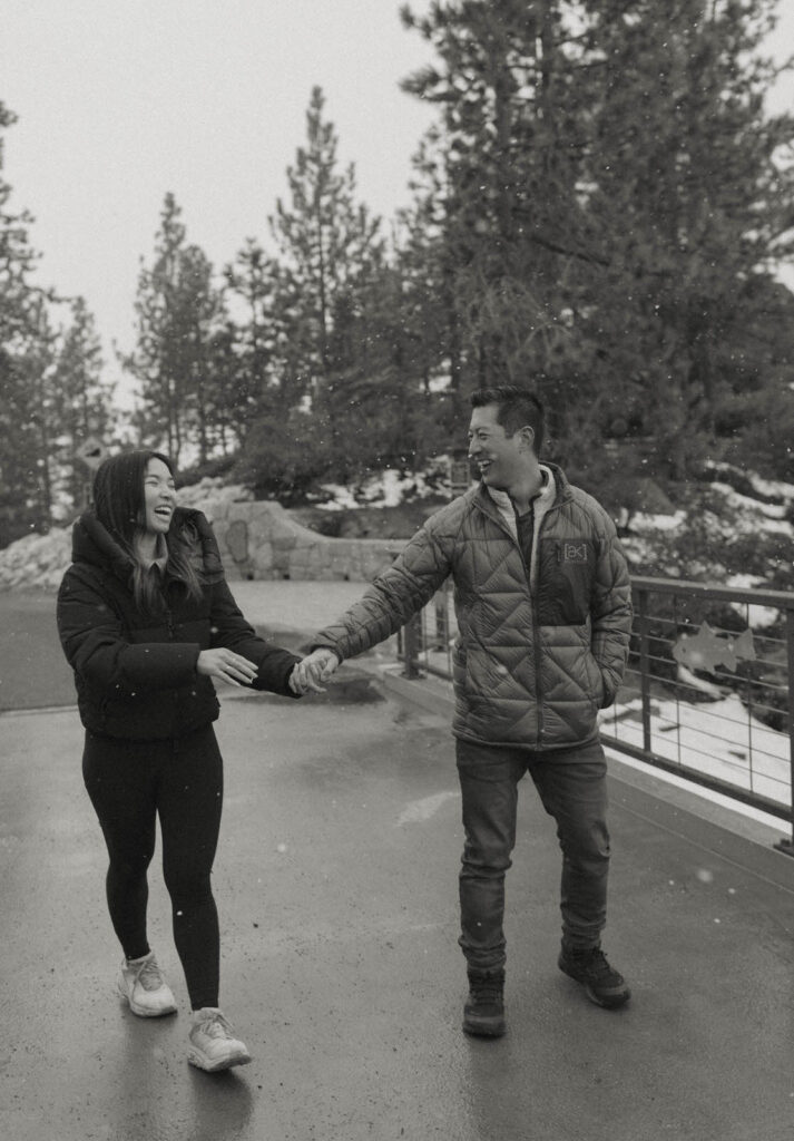 couple walking in lake tahoe laughing