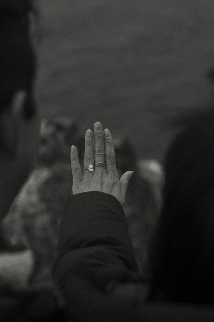 couple looking at a ring on woman's finger