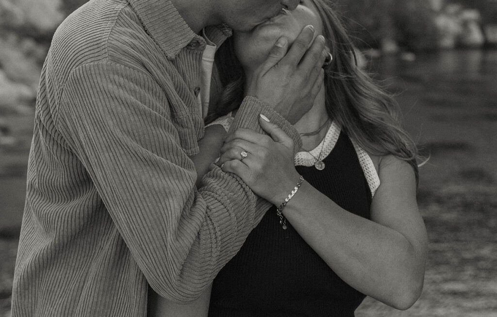 close up of couple kissing and holding each other 