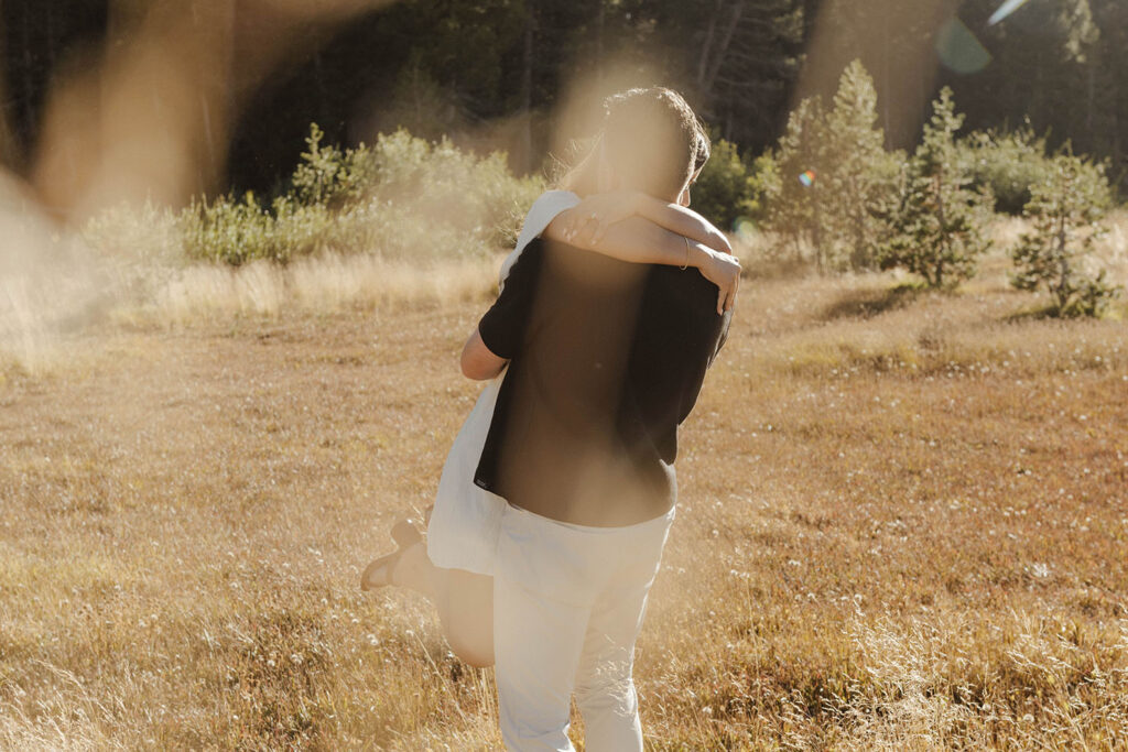 couple hugging at mount rose meadows in lake tahoe 