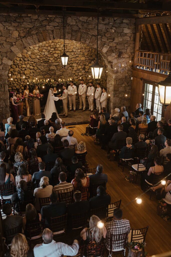 Wedding ceremony at Valhalla with couple under stone archway in Lake Tahoe